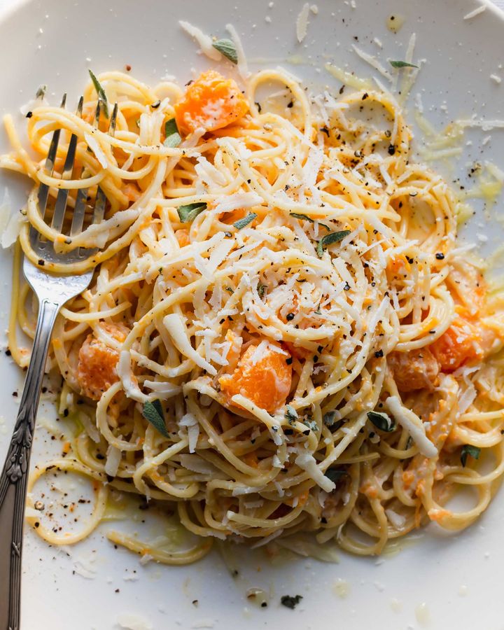 Close up on vegetarian carbonara with butternut squash with pecorino cheese and fresh sage