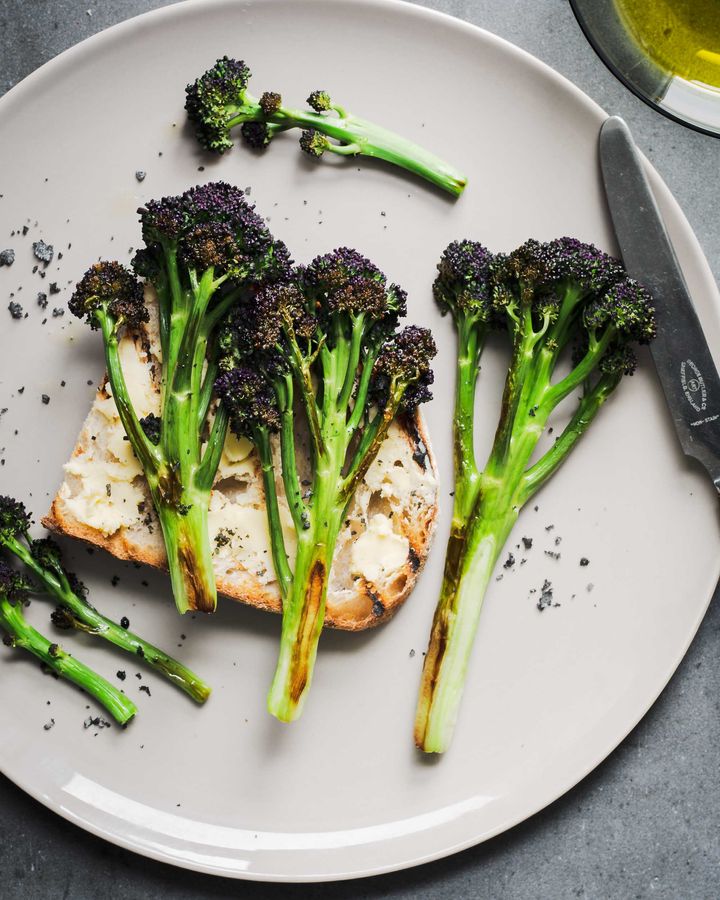 Griddled sourdough toast topped with seared purple sprouting broccoli