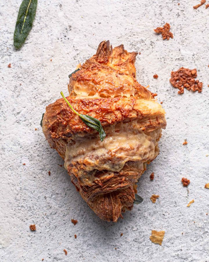 Twice-baked cheese croissant with crispy cheese and fried sage leaves