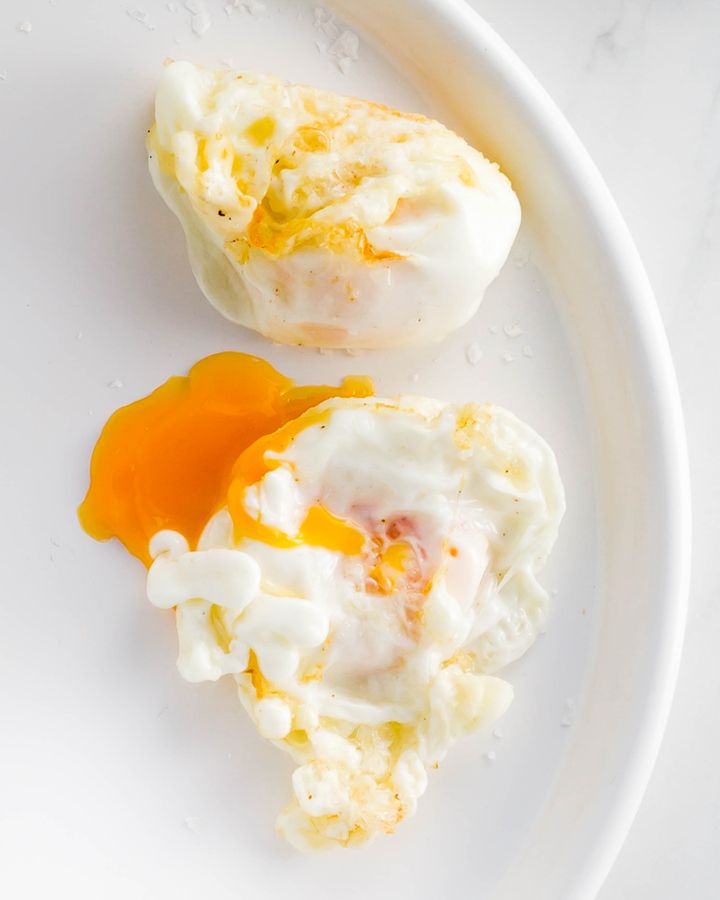 Close up of deep fried eggs with egg yolk oozing